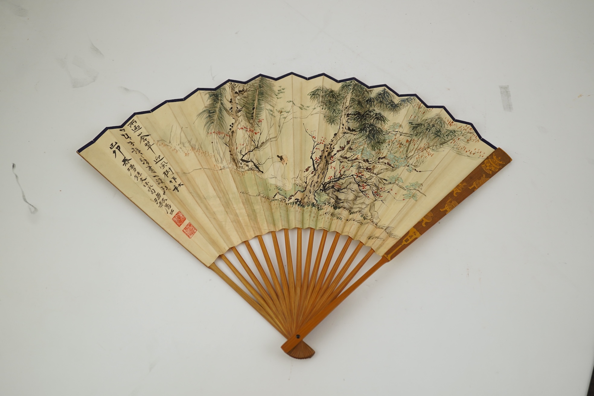 Two Chinese inscribed paper leaf fans, late 19th century